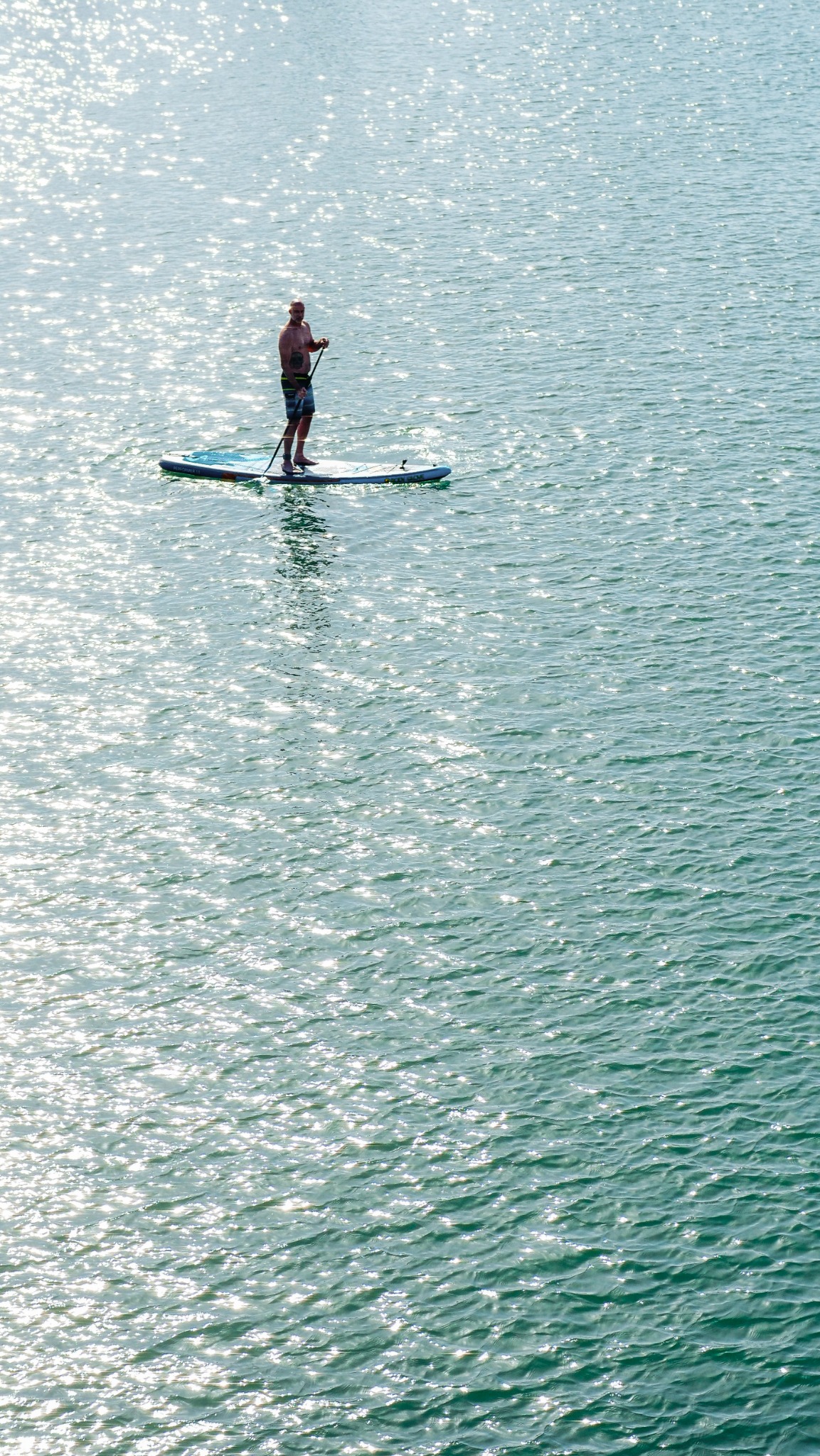 Stand-up paddleboarding on the bright blue Atlantic